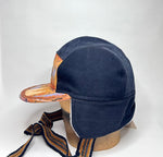 Vinterkeps 58-59cm - svart bomullscanvas, orangemönstrat