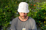 All white crochet bucket hat by Stina Knits