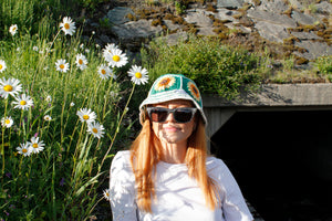 Green white striped crochet bucket hat by Stina Knits